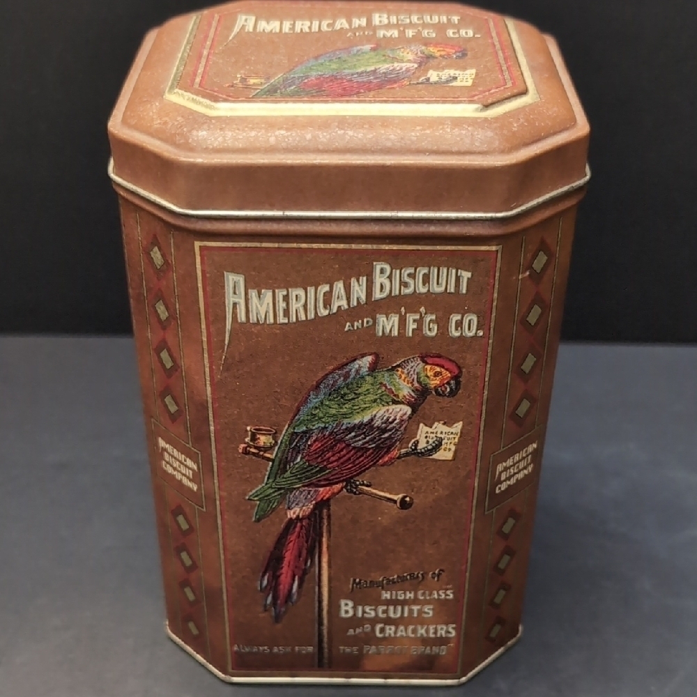 Vintage American Biscuit Tin,Brown With Parrot Design .